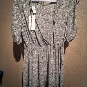 Open back black and white dress above knee length